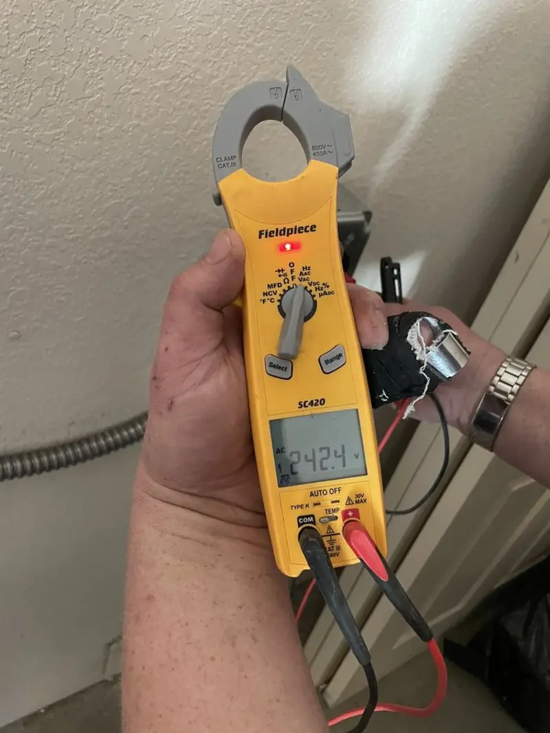 Voltage testing with clamp meter during Electrical Installation Services in Haughton